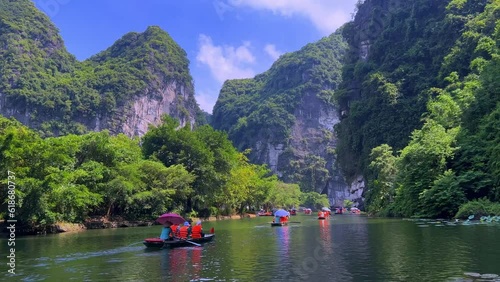 Trang An River Ninh Minh and Bai Dinh Mountain ranges in Vietnam only 3 hours drive from Hanoi. Beautiful winding river and large rising mountains. boats going through the caves in the river