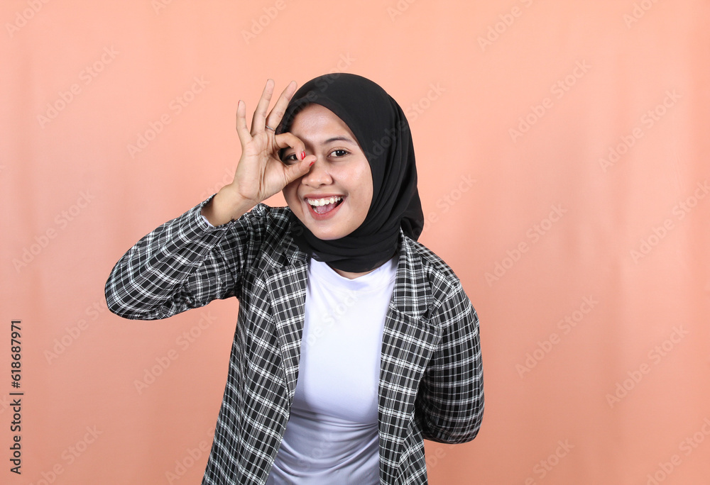 Beautiful Muslim Asian woman feeling happy