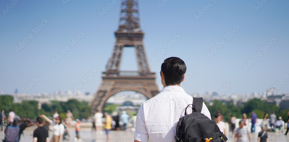 Young Man Gazing at the Eiffel Tower: A Captivating View