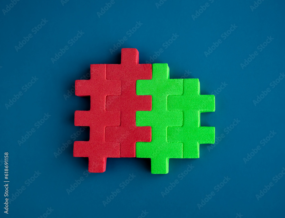 Obraz premium Red and green puzzle blocks are perfectly put together on blue background, minimal style. Business partnership, teamwork, collaboration, and contrast opposite colors concepts.