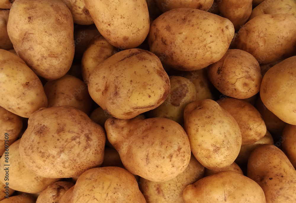 Piles of potatoes in a traditional market Piles of potatoes in a traditional market