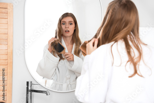 Shocked young woman with ha...