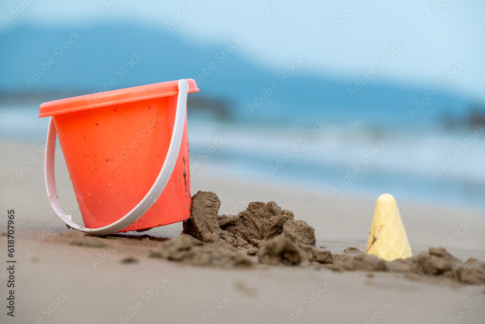Pail bucket and kids toys on the beach sand Pail bucket and kids toys on the beach sand