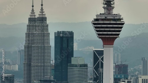 Kuala Lumpur, Malaysia - September 11, 2022: Aerial drone of Kuala Lumpur city with Petronas twin towers and Menara Kuala Lumpur. photo