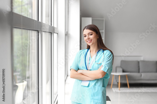 Smiling young female doctor...