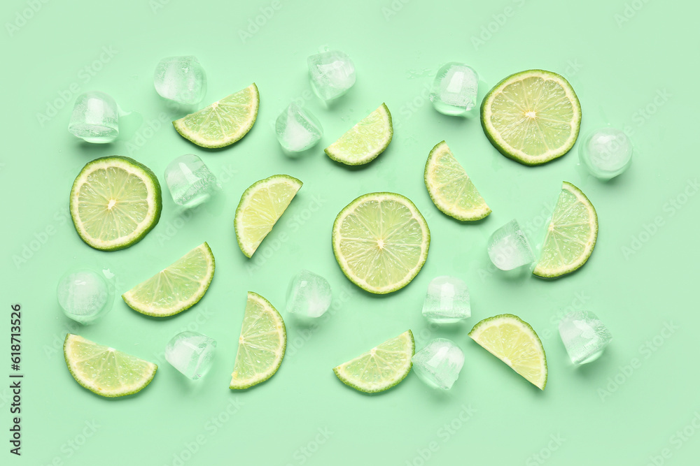 Lime slices with ice cubes on turquoise background Lime slices with ice cubes on turquoise background