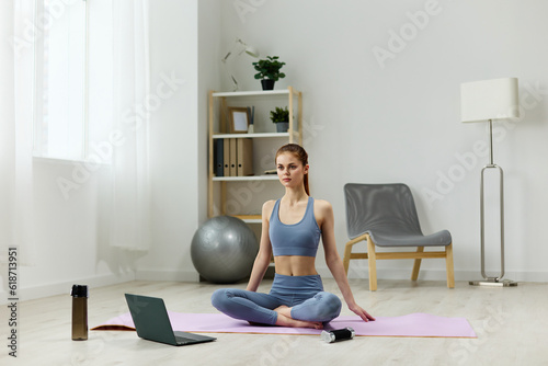 woman dumbbells lotus laptop mat training yoga health video home lifestyle