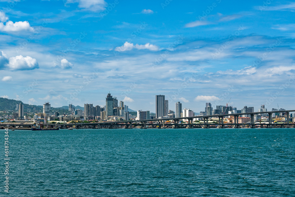 Cebu City, Philippines - April 28, 2023: Skyline of Metro Cebu as seen from a departing ship.