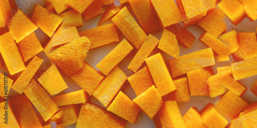 carrot cut into cubes close-up. A set of vitamins. Vegan food. Healthy food. Horizontal image. Banner for insertion into site.