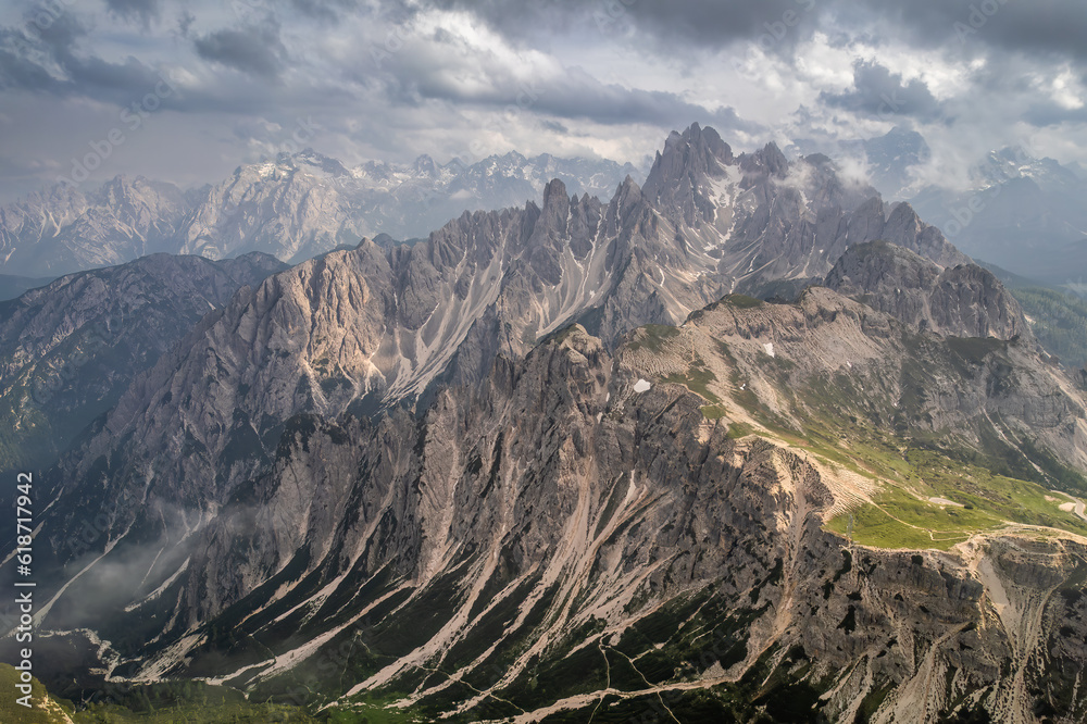 Cloudy aerial shot of the Cadini ranges in the Italian Dolomites 