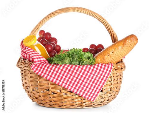 Fototapeta Naklejka Na Ścianę i Meble -  Wicker basket with tasty food for picnic and juice on white background