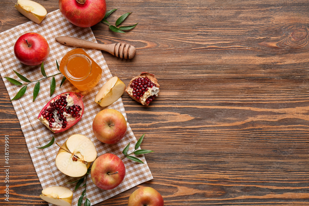 Composition with ripe fruits and honey on wooden background. Rosh hashanah (Jewish New Year) celebration Composition with ripe fruits and honey on wooden background. Rosh hashanah (Jewish New Year) celebration