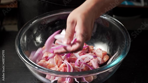 The marinating process of chicken drumsticks for making dry pot chicken photo