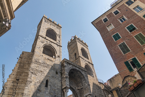A view of the old medieval stone entrance arch towers of Porta Soprana in Genoa, Italy photo