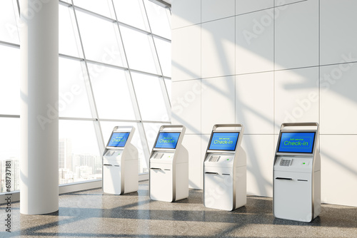 Fotografie Row of airport self service check in kiosks