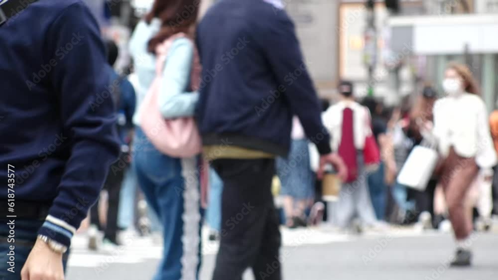 SHIBUYA, TOKYO, JAPAN -MAY 2023 : Crowd of people walking at Shibuya crossing. Busy downtown area in Tokyo. Japanese people, urban city life and metropolis concept 4K video. Time lapse shot in daytime SHIBUYA, TOKYO, JAPAN -MAY 2023 : Crowd of people walking at Shibuya crossing. Busy downtown area in Tokyo. Japanese people, urban city life and metropolis concept 4K video. Time lapse shot in daytime