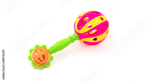 Colourful baby rattle with balls. White isolated background.