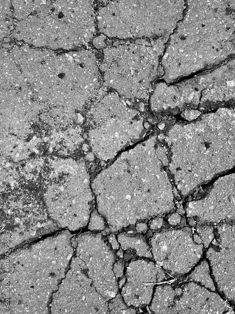 Obraz premium Texture cracked Asphalt. Broken Wall. Grunge background with space for text. Vertical stone backdrop with copy space.