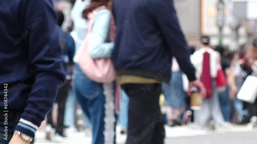 SHIBUYA, TOKYO, JAPAN -MAY 2023 : Crowd of people walking at Shibuya crossing. Busy downtown area in Tokyo. Japanese people, urban city life and metropolis concept 4K video. Time lapse shot in daytime SHIBUYA, TOKYO, JAPAN -MAY 2023 : Crowd of people walking at Shibuya crossing. Busy downtown area in Tokyo. Japanese people, urban city life and metropolis concept 4K video. Time lapse shot in daytime