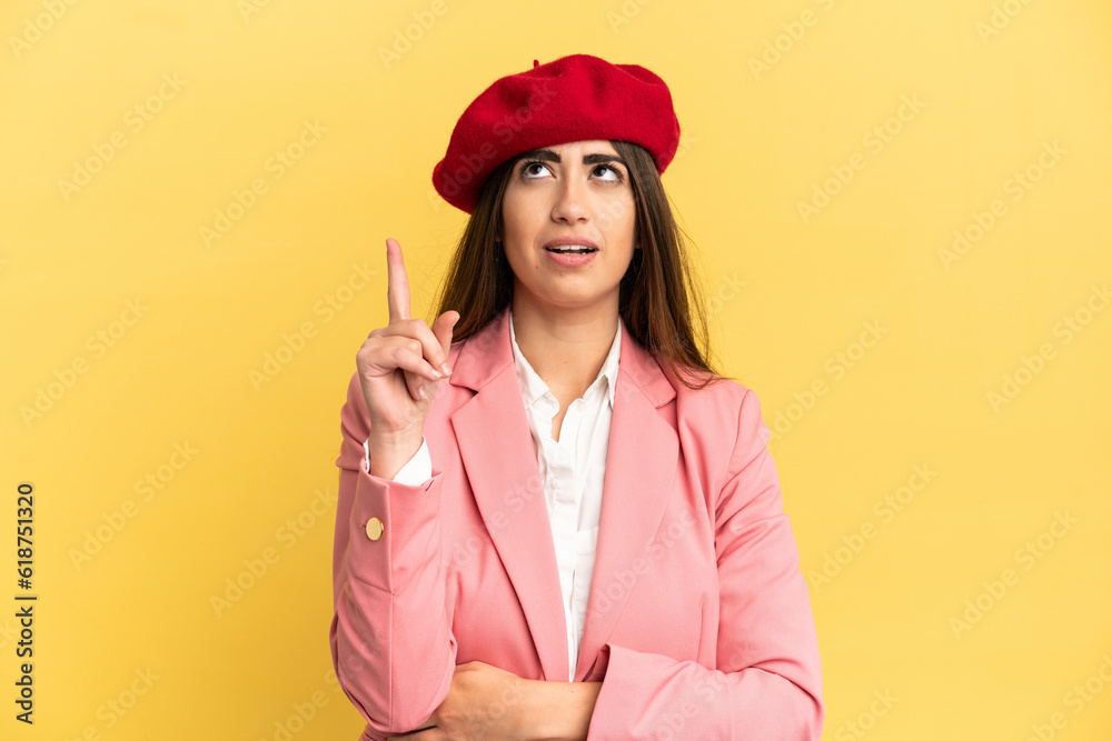 Young caucasian woman isolated on yellow background thinking an idea pointing the finger up Young caucasian woman isolated on yellow background thinking an idea pointing the finger up