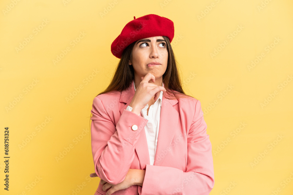 Young caucasian woman isolated on yellow background having doubts and thinking Young caucasian woman isolated on yellow background having doubts and thinking