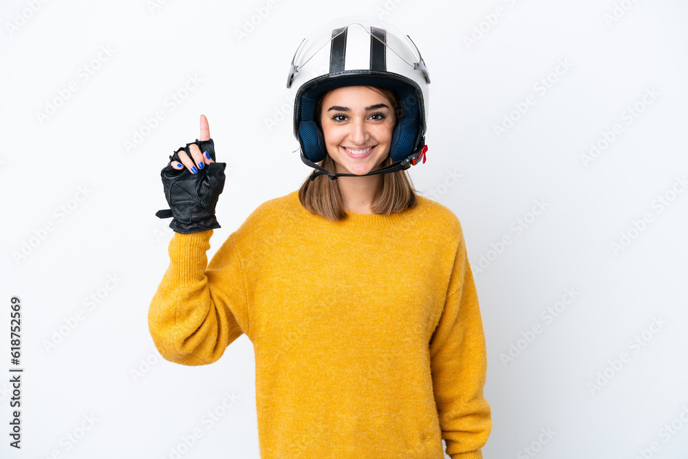 Young caucasian woman with a motorcycle helmet isolated on white background pointing up a great idea Young caucasian woman with a motorcycle helmet isolated on white background pointing up a great idea