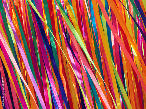 Multi-colored satin ribbons flutter in the wind
