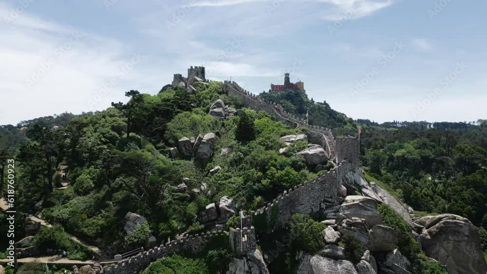 Aerial of the medieval Castle of the Moors in Portugal on top of the green hill Aerial of the medieval Castle of the Moors in Portugal on top of the green hill