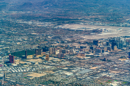 aerial landscape view of Las Vegas area with famous buildings along the Las Vegas Blvd (Las Vegas Strip) and main Airport (KLAS, LAS)  
