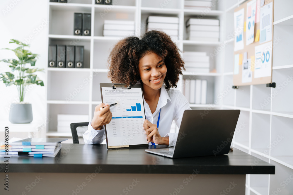 Business woman using tablet and laptop for doing math finance on an office desk, tax, report, accounting, statistics, and analytical research concept in office