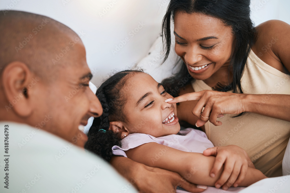 Family, happiness and father with mother and daughter, touching nose and relax in bed, playful and bonding. Carefree, love and fun with people in bedroom, happy and spending time together at home