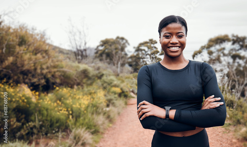 Fitness, smile and portrait with black woman in nature for health, workout and running. Performance, sports and exercise with female runner training on mountain trail for speed, marathon and wellness