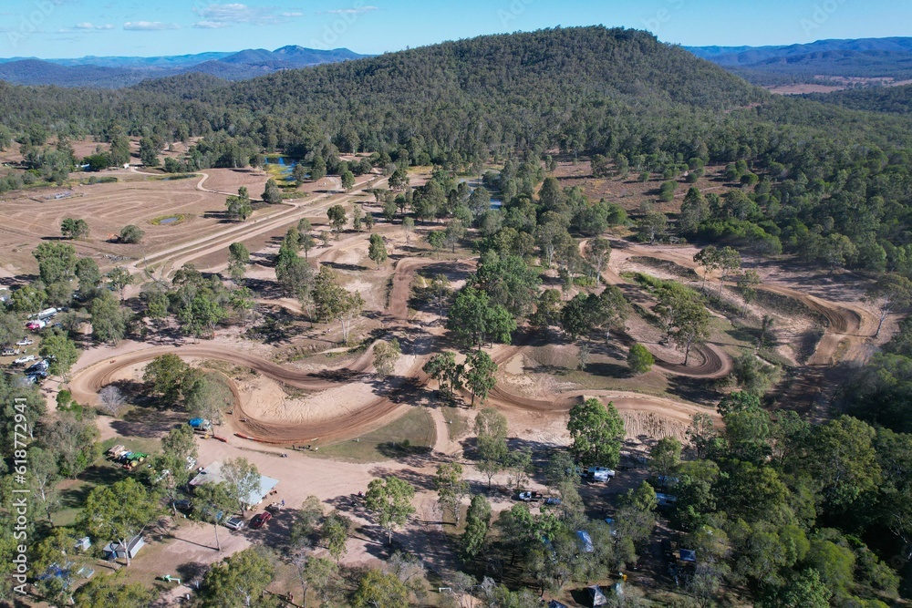 Photograph of a motocross track in The Glen Echo, featuring a dirt track with muddy corners