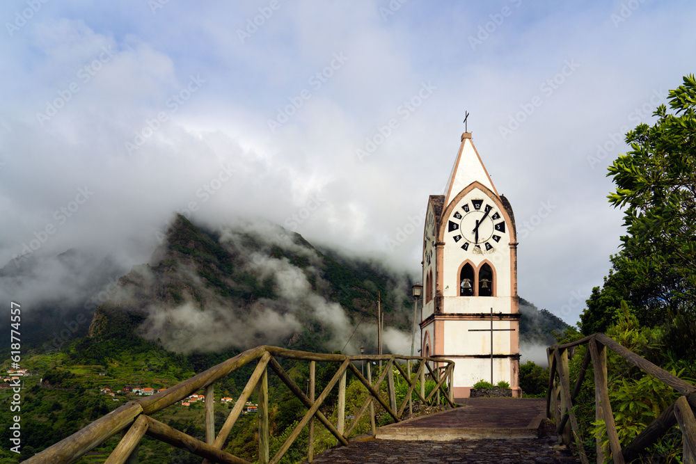 The chapel-tower Nossa Senhora de Fatima on top of green hills, Sao Vicente, Madeira island, Portugal
