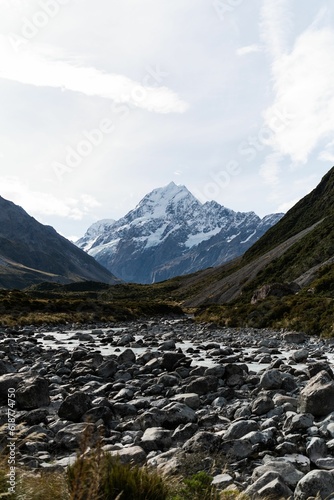 Scenic view of a valley with Mount Cook in the background.