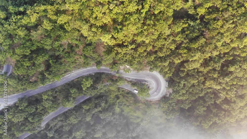 High quality 4K aerial video of taken with a drone flying over the roads amidst the green forest. High quality 4K aerial video of taken with a drone flying over the roads amidst the green forest.