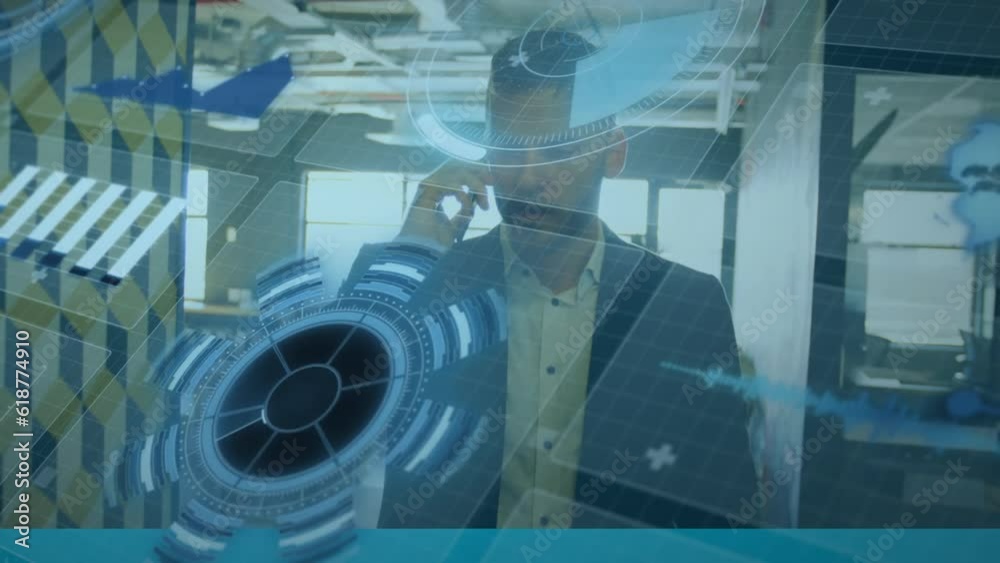 Animation of multiple graphs, map and globe over caucasian man talking on cellphone in office