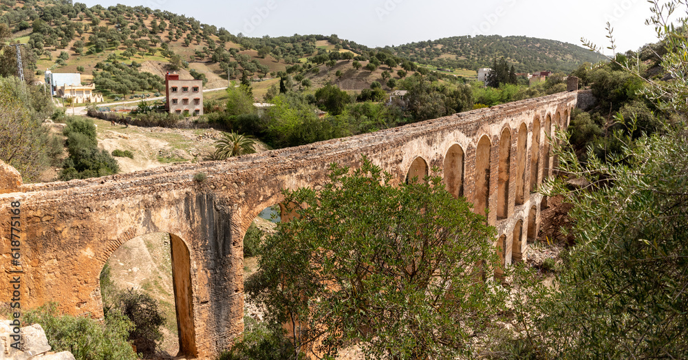 Ancient Haroune aqueduct near the archeological Roman city of Volubilis in Morocco