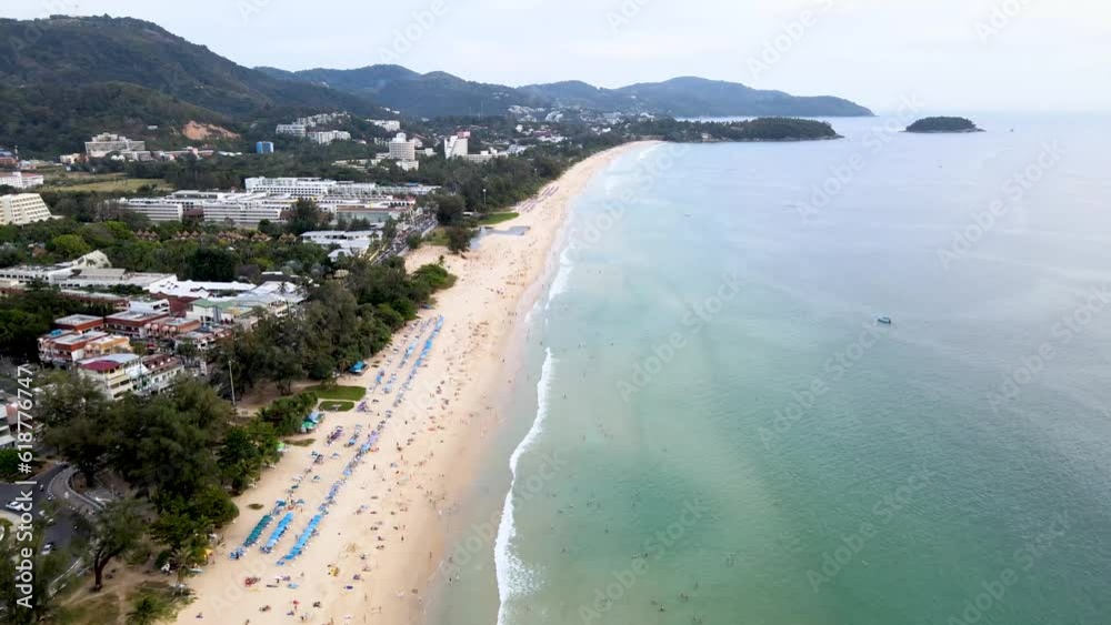Drone Video High angle shots Kata Beach, Karon, beautiful beach in Phuket, Thailand, the perfect place to relax. For families on holidays, sunbathing, playing water activities. Drone Video High angle shots Kata Beach, Karon, beautiful beach in Phuket, Thailand, the perfect place to relax. For families on holidays, sunbathing, playing water activities.