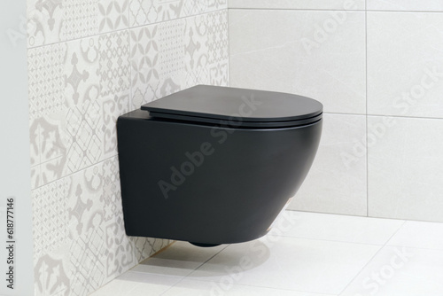 Fotografie Black wall hung toilet in the bathroom