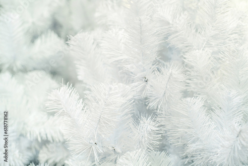 Light background of artificial, white firs. Flat lay frame. Blank for a designer
