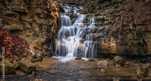 Landscape of a waterfall with long exposure in the daylight