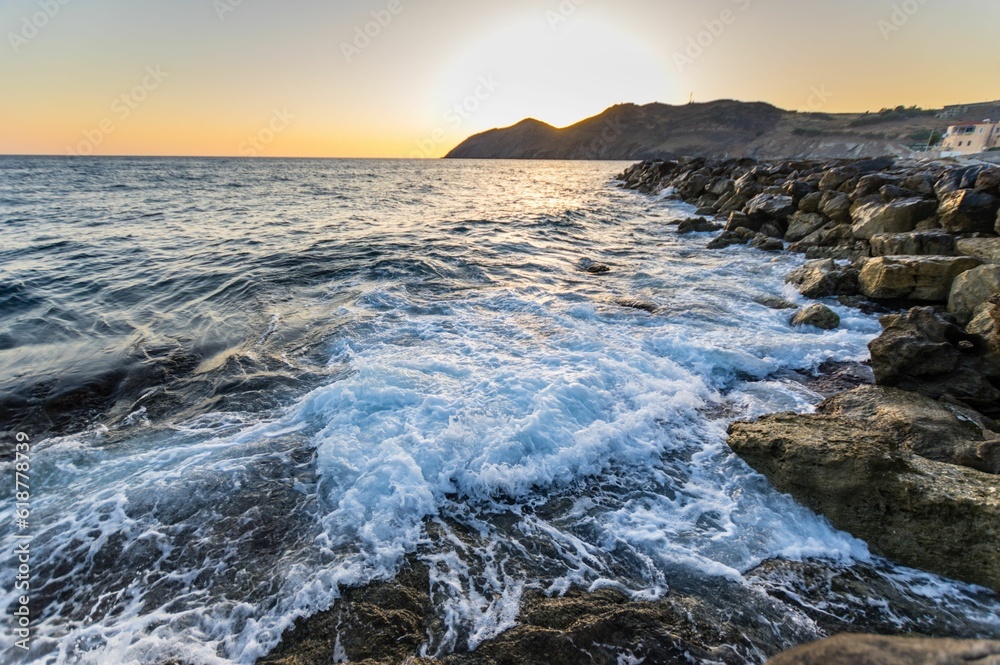 Mesmerizing view of a beautiful seascape during sunrise in Crete, Greece