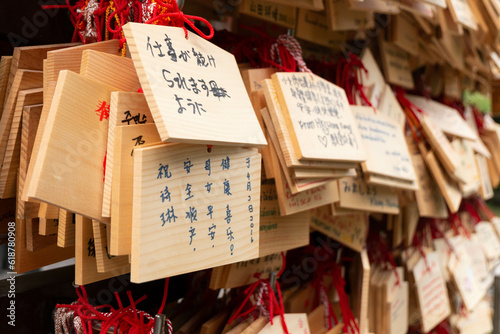 White paper tie knot in Tokyo and Kyoto Japan shrine temple tourism wish and pray for luck, symbol of faith and fortune spiritual Asia Buddhism culture tradition hope for good chance future destiny photo