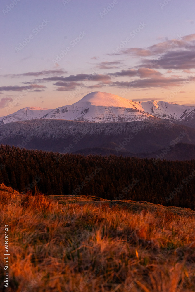 landscape in the mountains, sunset, view of the snowy peak of Mount Petros, Hoverla, Montenegrin mountain range, travel, screensaver, poster, poster, cover, print, spring, winter