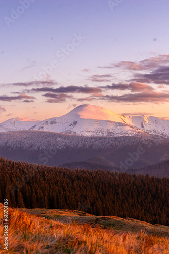 landscape in the mountains, sunset, view of the snowy peak of Mount Petros, Hoverla, Montenegrin mountain range, travel, screensaver, poster, poster, cover, print, spring, winter photo