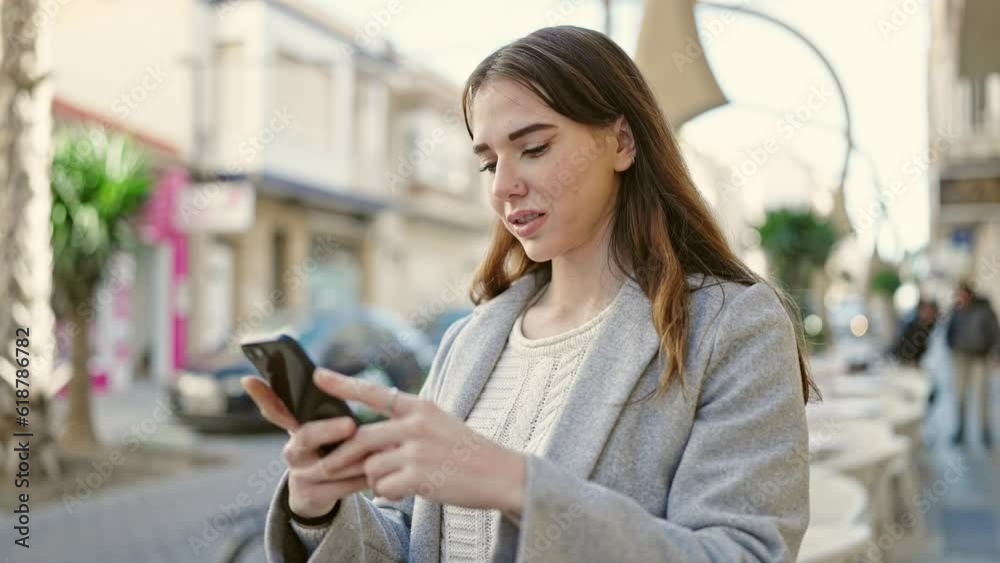 Young hispanic woman using smartphone smiling at coffee shop terrace Young hispanic woman using smartphone smiling at coffee shop terrace
