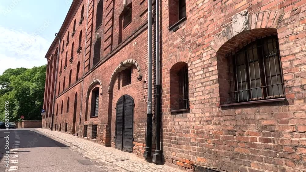Old brick building. A walk through the historic streets in the center of the old town. Old historic street. Torun, Poland. Old brick building. A walk through the historic streets in the center of the old town. Old historic street. Torun, Poland.
