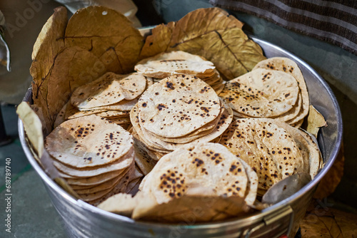 Batch of chapati round flatbreads in bucket for langar in sikh gurudwara temple, roti flatbreads photo