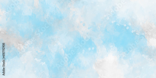 Light blue watercolor background with vintage texture design. Abstract blue watercolor background handprint colorful gradient ink. Blue sky background with clouds.